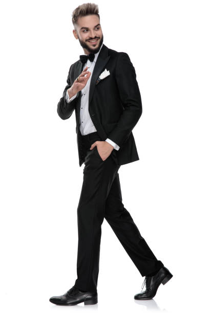 istock businessman walking one way while saluting someone the other way 1203700195