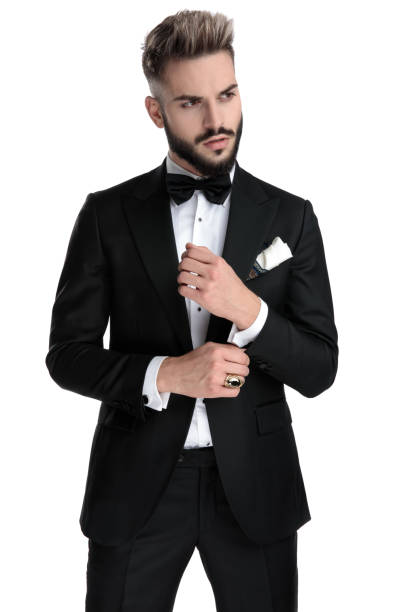 istock businessman standing and fixing sleeve cool 1203700852