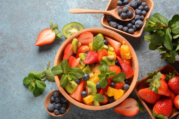 istock Bowl of healthy fresh colorful fruit salad 1203701059