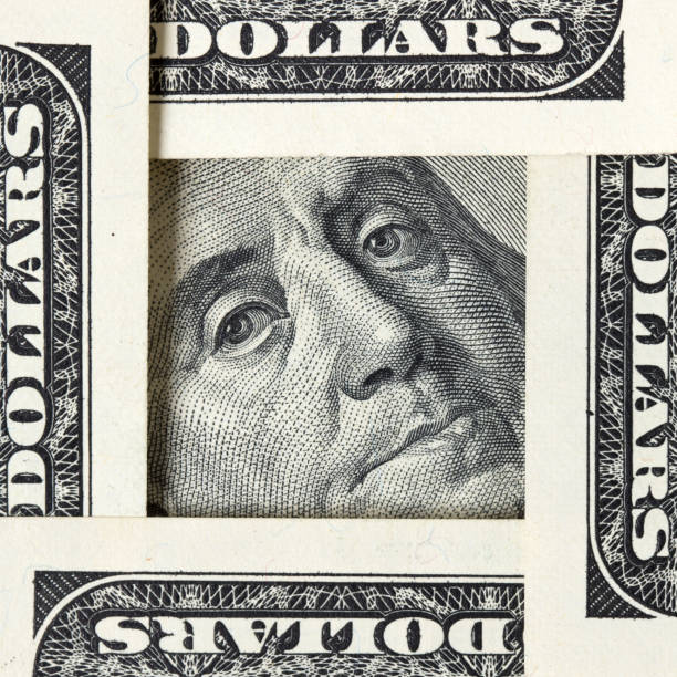 istock Square made of $100 bills with Benjamin Franklin inside 1203701119