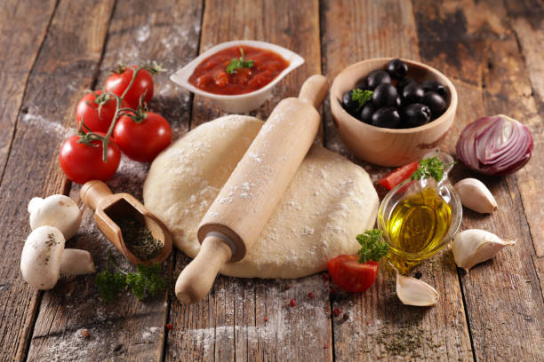 istock assorted of pizza dough and ingredient 1203701375