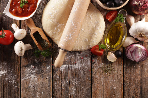 istock assorted of pizza dough and ingredient 1203701379