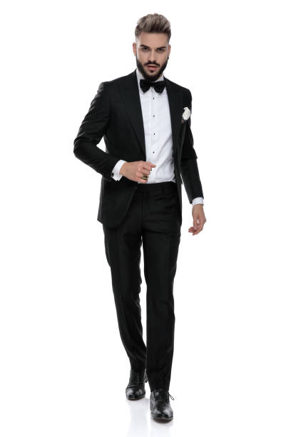 istock businessman wearing black tuxedo walking with class 1203702131