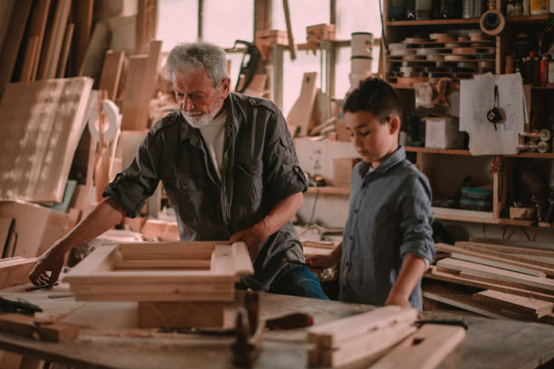 istock Grandfather teaching his grandson 1203702644