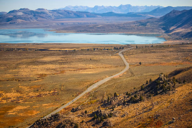 Mono Lake from viewpoint. Panoramic view to the Mono Lake Park. The lack of an outlet causes high levels of salts to accumulate in the lake. These salts also make the lake water alkaline. Mono Lake stock pictures, royalty-free photos & images