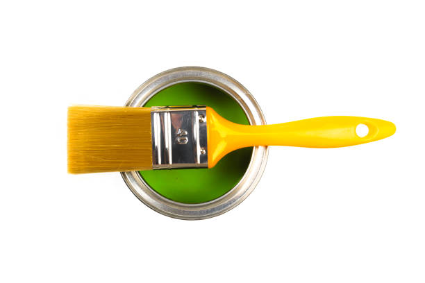 istock Can with green paint and brush isolated on white background top view - Image 1203703996