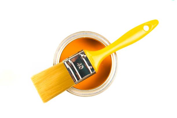 istock Can with yellow paint and brush isolated on white background top view - Image 1203704003