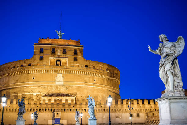 The historic city of Rome in the Italian province of Lazio on November 03, 2013:  Historic Castel Sant'angelo at dusk on the bank of the Tiber River in Rome Italy