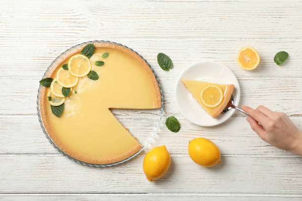 istock Composition with lemon tart on white wooden background, top view 1203706266
