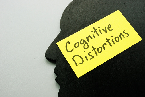 Cognitive Distortions sign on the head shape as symbol of mind.
