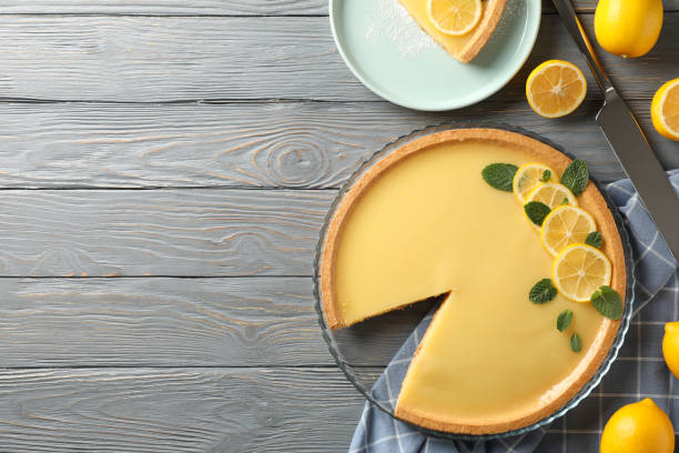 istock Composition with lemon tart on grey wooden background, top view 1203708092