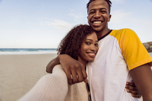 istock Couple Enjoy Beautiful Sunny Day On The Beach 1203708741