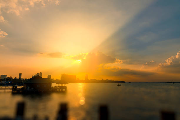 Beautiful dramatic sky clouds with light rays at sunset. Natural landscape for background