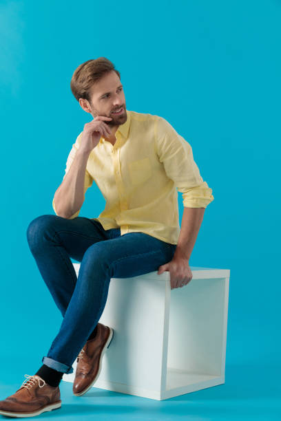 istock Eager casual man curiously looking away 1203709681