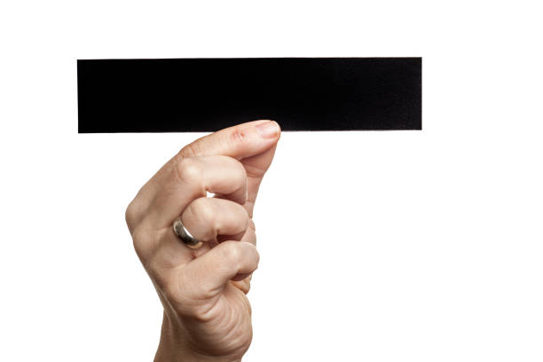 istock Woman holding blank card 1203710578