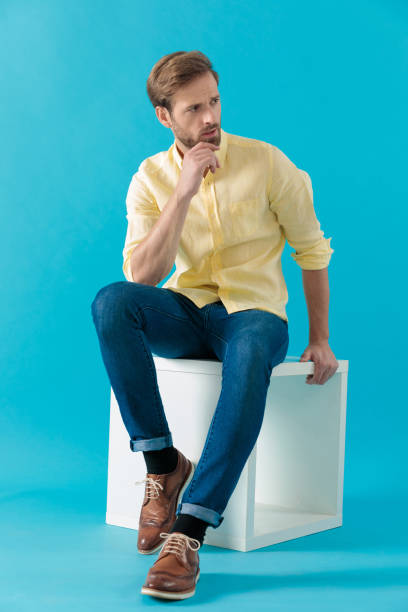 istock Bothered casual man looking away and frowning 1203710960