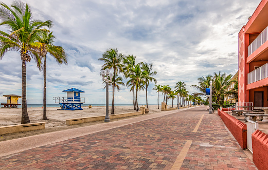 Boardwalk and bikeway along the beach in Hollywood on a cloudy day. A popular tourist attraction in Broward County, Florida, USA.