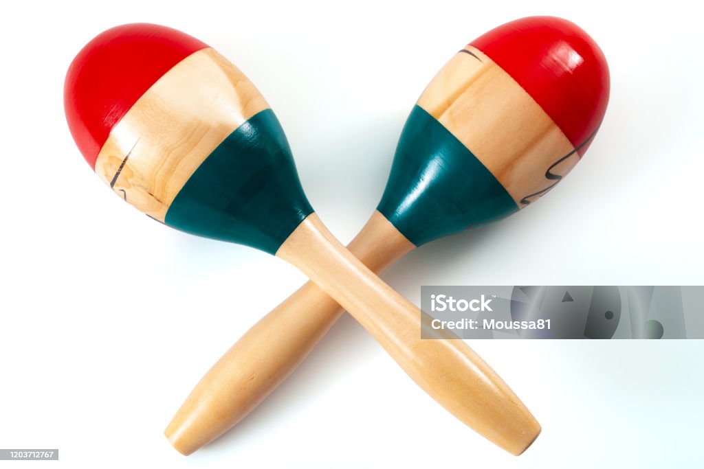 Caribbean and latin music and traditional musical instruments conceptual idea with wood maracas or rumba shakers isolated on white background with clipping path cutout Maraca Stock Photo