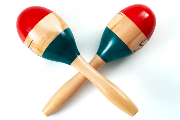 Caribbean and latin music and traditional musical instruments conceptual idea with wood maracas or rumba shakers isolated on white background with clipping path cutout Caribbean and latin music and traditional musical instruments conceptual idea with wood maracas or rumba shakers isolated on white background with clipping path cutout maraca stock pictures, royalty-free photos & images