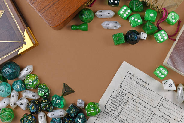 istock Flat lay concept design for tabletop role playing with colorful green and white RPG dices, character sheet and rule books with empty copy space on brown background 1203714089