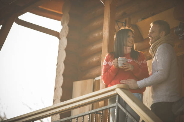 istock Couple having cuddles and enjoying sunny winter day 1203714373