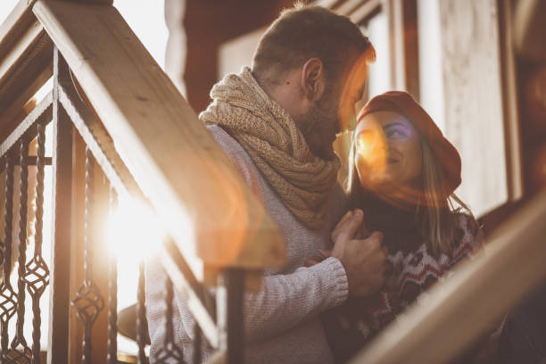 istock Affectionate young couple falling in love in warm winter sunshine 1203715909