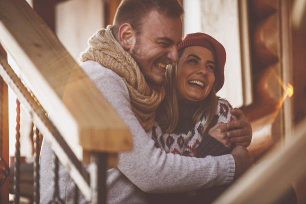 istock Young couple in embrace having a laugh 1203715913