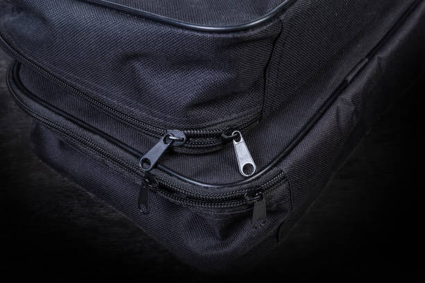 istock Fragment of two small black bags with plastic zippers 1203717321