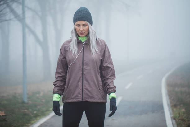 istock Exercising at foggy day 1203717833