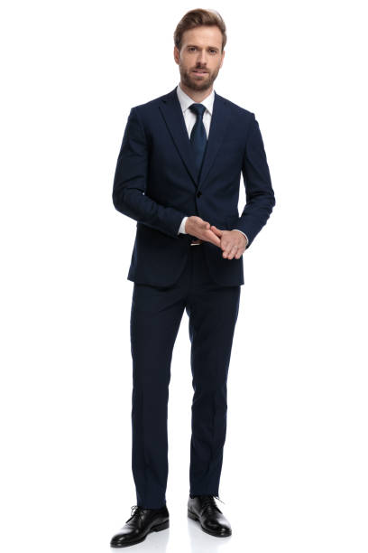 istock young confident businessman in navy blue suit rubbing palms 1203717937
