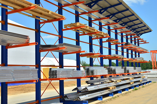 Warehouse Cantilever Racking Systems for storage Aluminum Pipe or profiles. Pallet Rack and Industrial Warehouse Racking. Steel profiles, sheet metal build-profile - Image