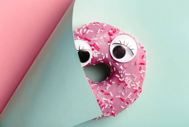 Funny sweet donut on a colorful  background. Top view