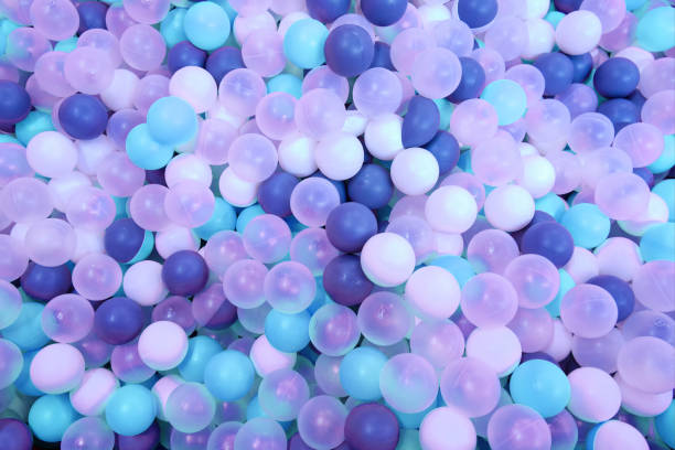 istock Background from multicolor balls - white and dark blue colors. Top view 1203721191