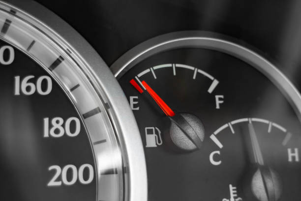 istock Close-up of car dashboard showing speedometer, fuel indicator and temperature indicator. 1203723787