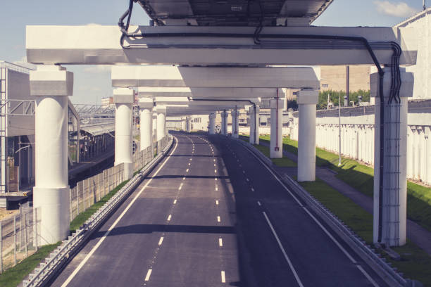 istock New empty road under the overpass next to the railway tracks 1203724121