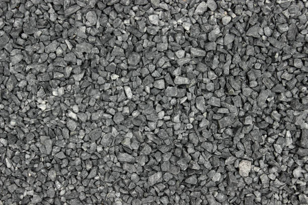 istock Gravel grey pebbles stone texture 1203724308