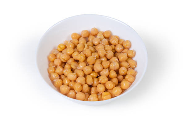 istock Boiled chickpeas in the white bowl on a white background 1203725508