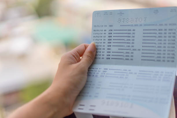 istock Woman hold passbook for checking balance of statement 1203726883
