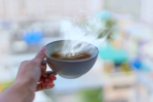 istock Milk cup handle and smoke outside the window 1203726956