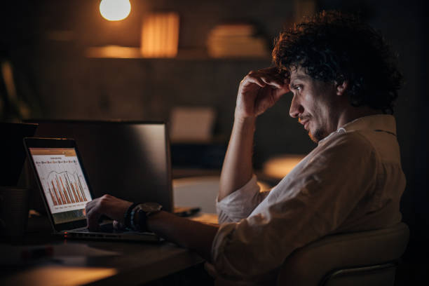istock Business man working late in the office 1203727358
