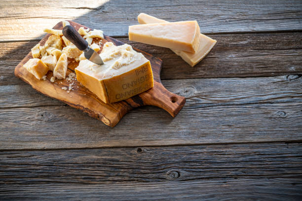 istock Parmesan Reggiano cheese on cutting board 1203728308