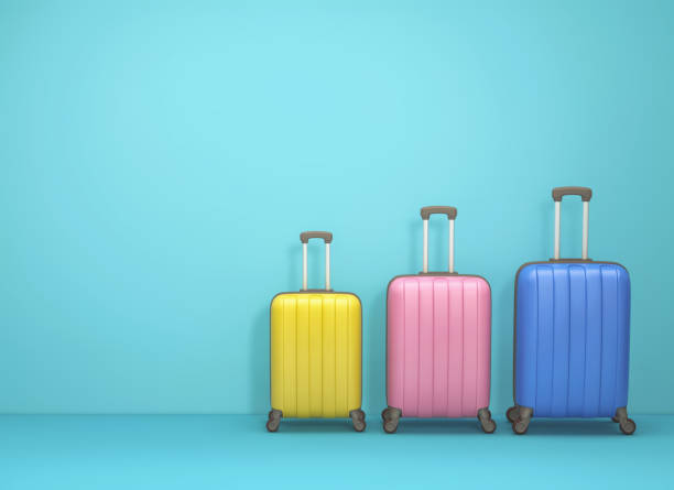 istock Three suitcases on blue background. Family travel concept 1203728594