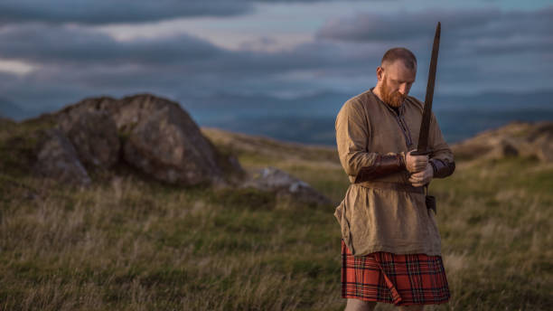 istock Scottish Redhead Warrior wearing a kilt 1203729021