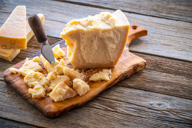 istock Parmesan Reggiano cheese on cutting board 1203729879
