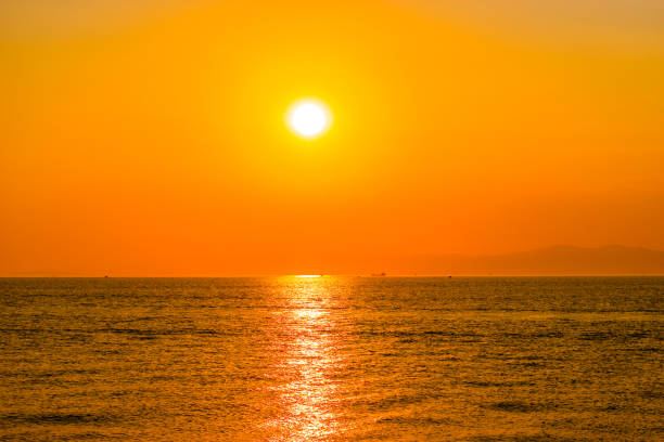 istock Bright orange sunset over the sea. 1203730618