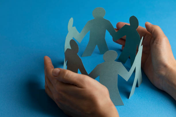 istock Hand Protecting Paper Cut Out Figure 1203730756