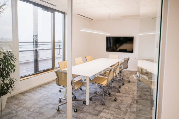 istock Small corporate office board room and conference table 1203732794