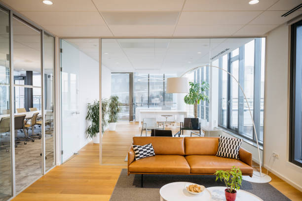 istock Modern corporate office with board room and sitting areas 1203732799