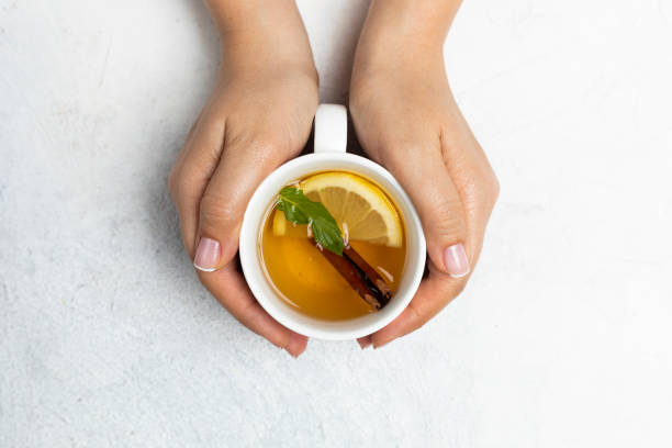 istock Woman with Herbal Tea 1203733187