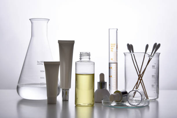 istock Cosmetic bottle containers and scientific glassware, Blank package for branding mock-up, Pharmaceutical skincare by dermatologist doctor, Research and develop beauty product concept. 1203733277